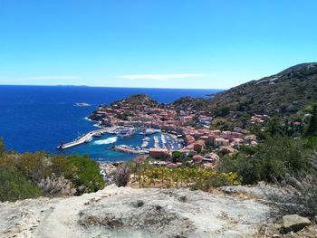 Scenic view of sea against clear blue sky