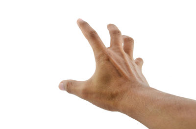 Close-up of human hand against white background