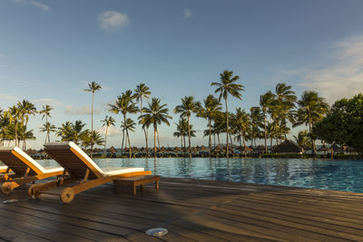 Scenic view of swimming pool by sea against sky