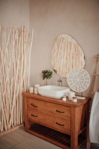 Luxury interior of big bathroom at modern african style with oval bathtub in natural lighting