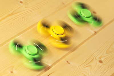 High angle view of fidget spinners on table