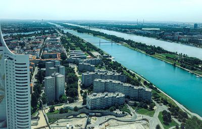 High angle view of river amidst buildings in city
