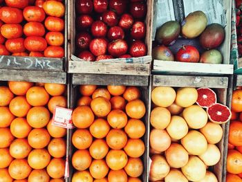 Full frame shot of fruits in crates for sale at market