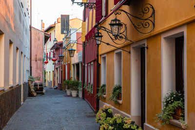 Narrow street amidst buildings in city