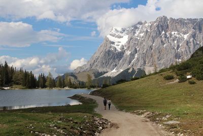 Scenic view of lake and mountains against sky