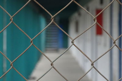 Full frame shot of chainlink fence against sky