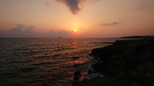 Scenic view of sea against sky during sunset