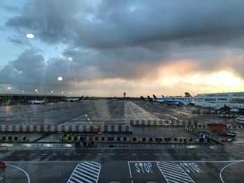 Airplane on runway against sky