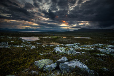 Scenic view of landscape against sky during sunset