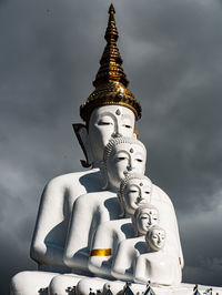 Low angle view of statue against building