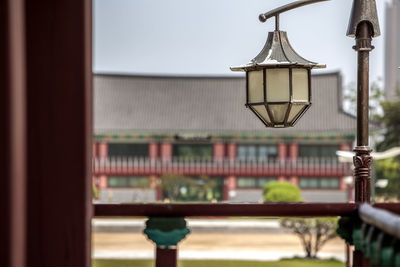 Street light by balcony of traditional building at michuhol park