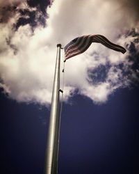 Low angle view of flag against sky