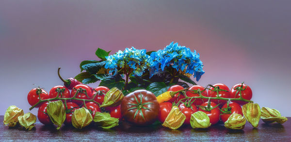 Close-up of strawberries on table against blue background