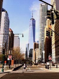 City street and modern buildings against sky