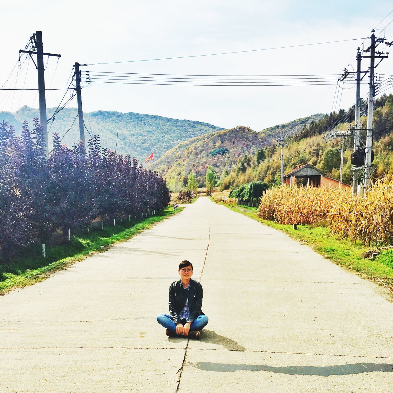 leisure activity, childhood, diminishing perspective, mountain, lifestyles, elementary age, the way forward, full length, boys, road, casual clothing, vanishing point, innocence, day, outdoors, sky, footpath, rural scene, nature, scenics, tranquil scene, mountain range, tranquility