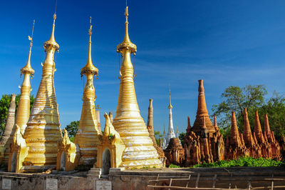 Low angle view of temple against building