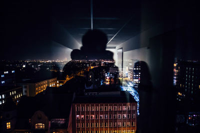 Illuminated buildings in city at night