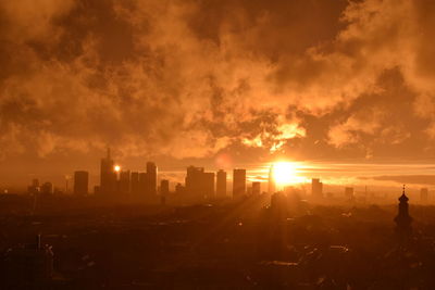 Cityscape against sky during sunset