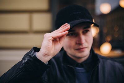 Portrait of young man wearing hat