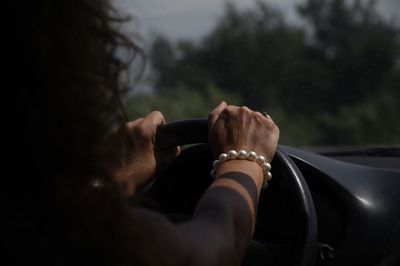 Close-up of hand holding vehicle