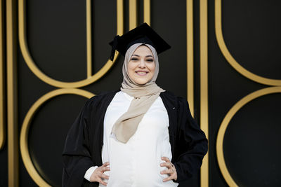 Smiling woman wearing graduation hat