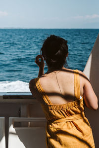 Rear view of woman looking at sea