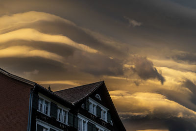 Low angle view of building against sky during sunset