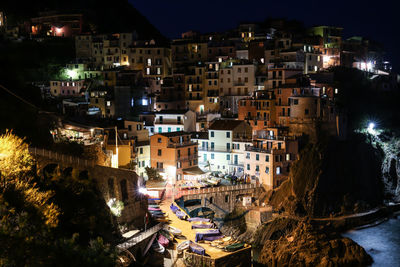 High angle view of illuminated houses in town