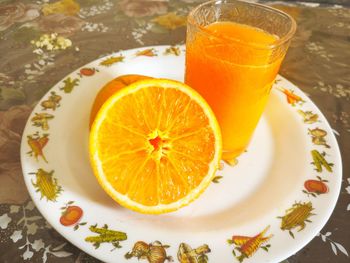 Close-up of orange slice in plate