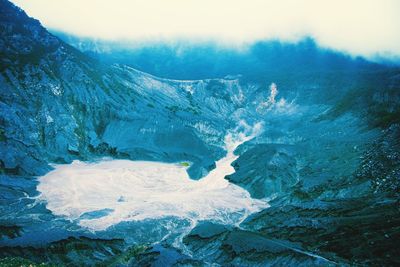 Scenic view of snow covered mountains