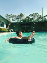 Man swimming in pool