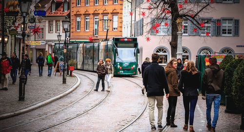 People walking on street in city