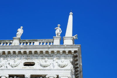 Low angle view of building against blue sky