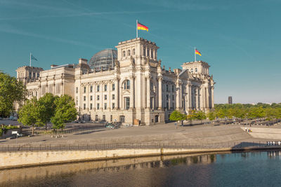 River by the reichstag against blue sky