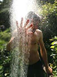Close-up of man standing in water