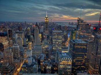 High angle view of city lit up at dusk