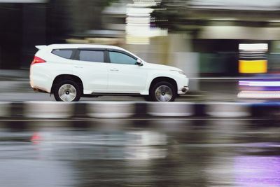 Blurred motion of car on road in city