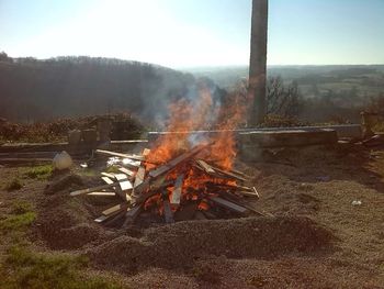 High angle view of bonfire on field against sky