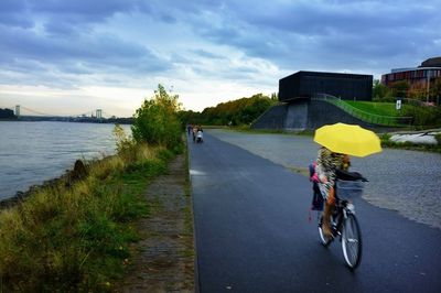 Empty road against cloudy sky
