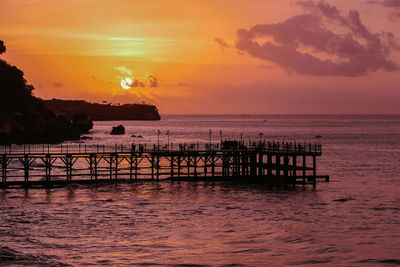 Scenic view of sea against orange sky