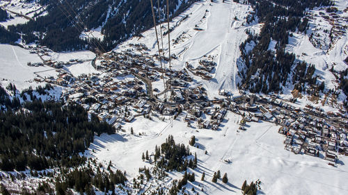 Snow covered landscape against mountain