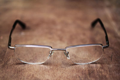 High angle view of eyeglasses on wooden table