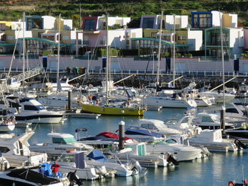 High angle view of yachts at harbor in city