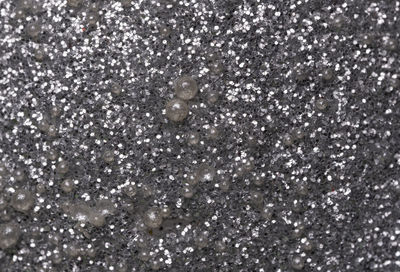 Full frame shot of snowflakes on glass