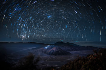 Scenic view of star field against sky at night