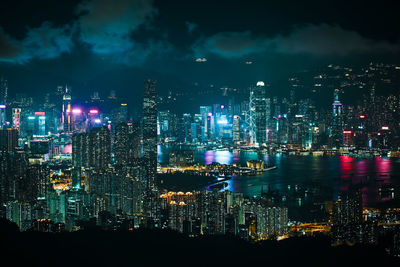 High angle view of illuminated buildings in city at night