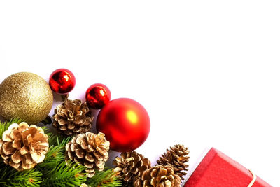 Close-up of christmas decorations over white background