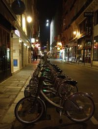 Cars parked on street at night