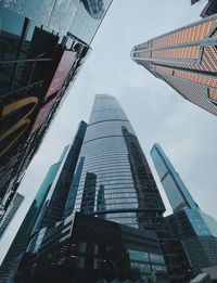 Low angle view of skyscrapers against sky