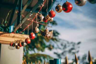 Close-up of christmas decorations hanging on tree